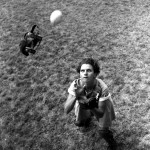 Taken from high angle, picture shows Mary Rountree, catcher, in fast action after foul fly. Cap and mask flying behind head and proper stance assumed, April 22, 1948. (Florida Memory)